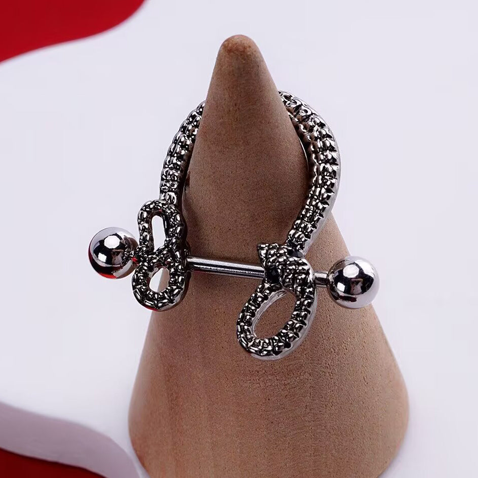 Side view of twin snake nipple shield displayed on a cone stand