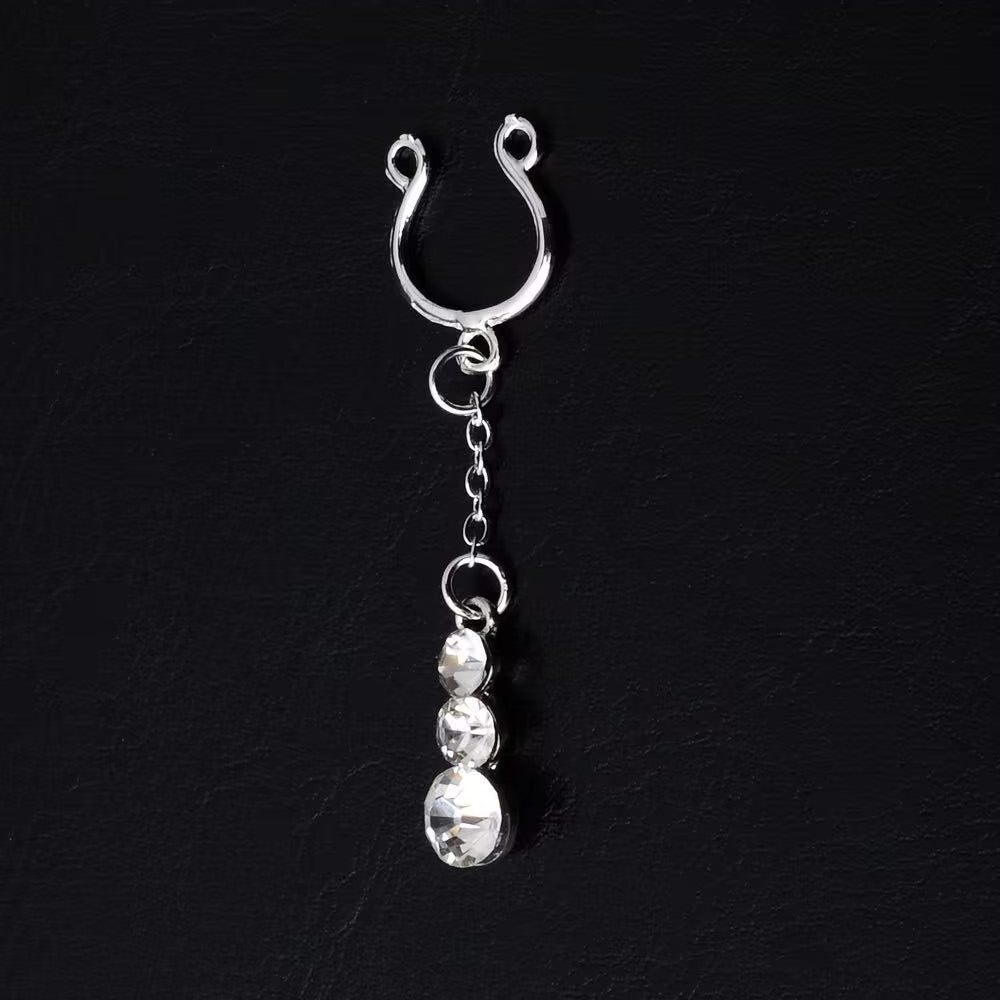 Close-up of a clip-on nipple hoop with crystal charms on a black background.