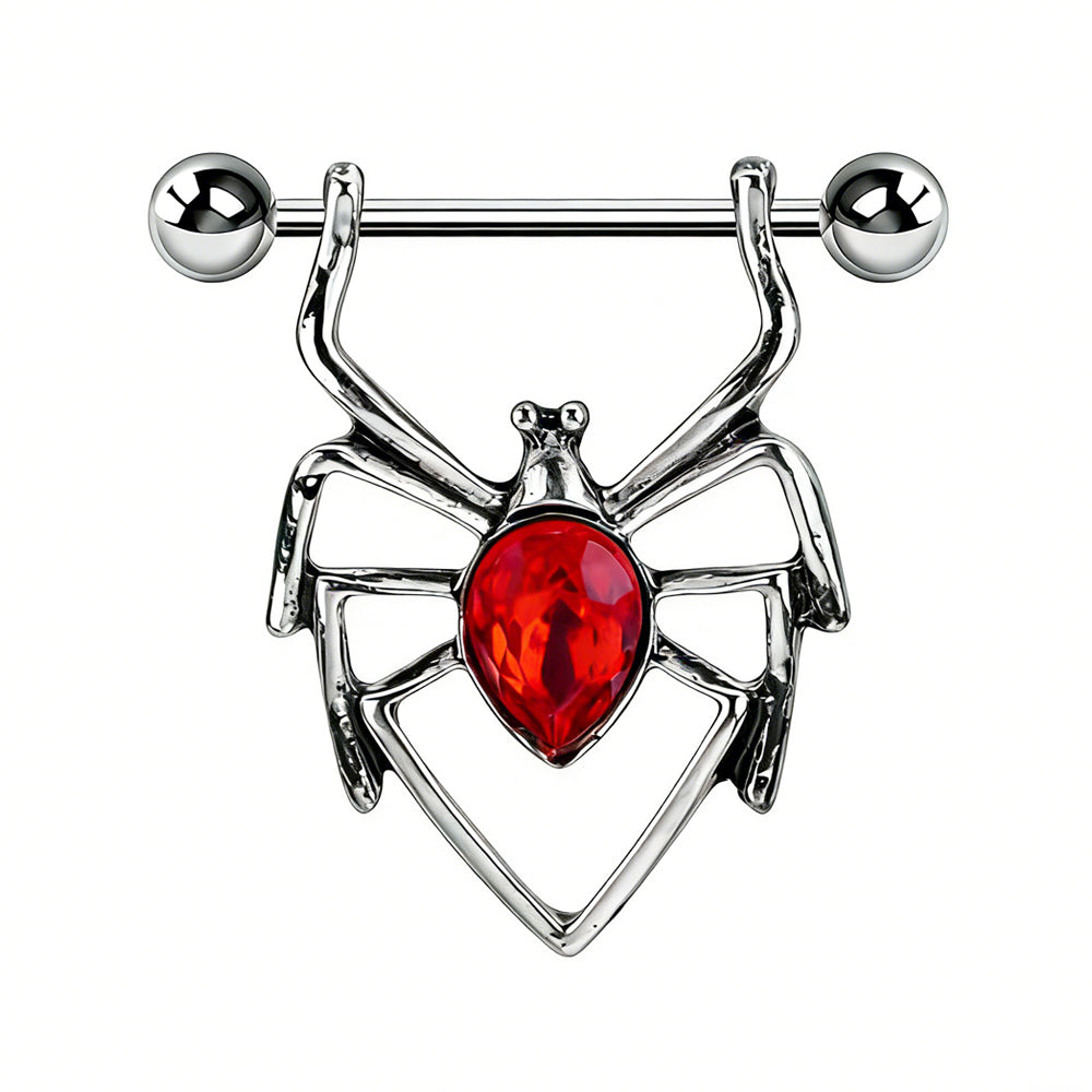 Close-up of a gothic spider nipple ring featuring a vibrant red pear-shaped crystal center.