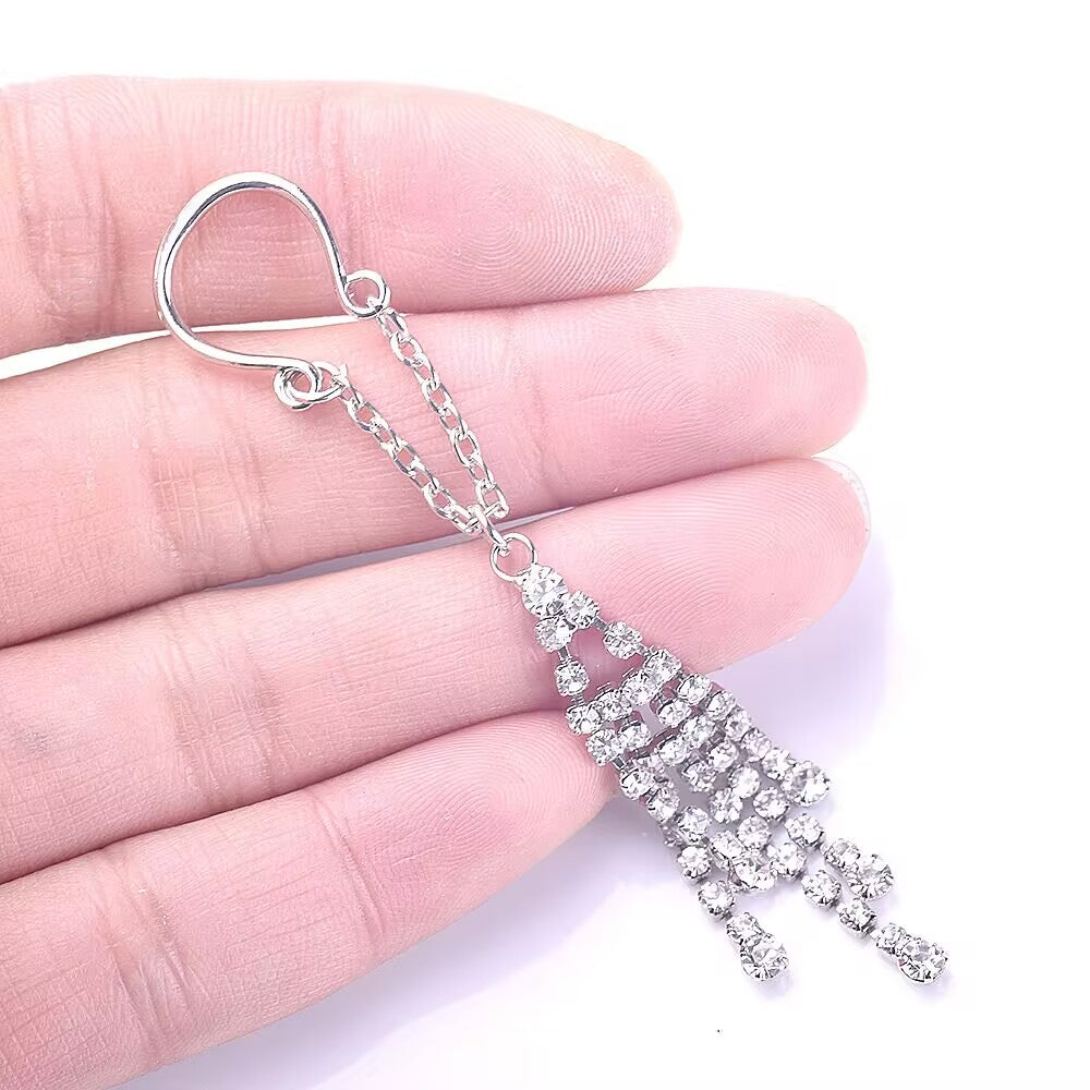 Hand holding the crystal dangle jewelry to show scale and sparkle.