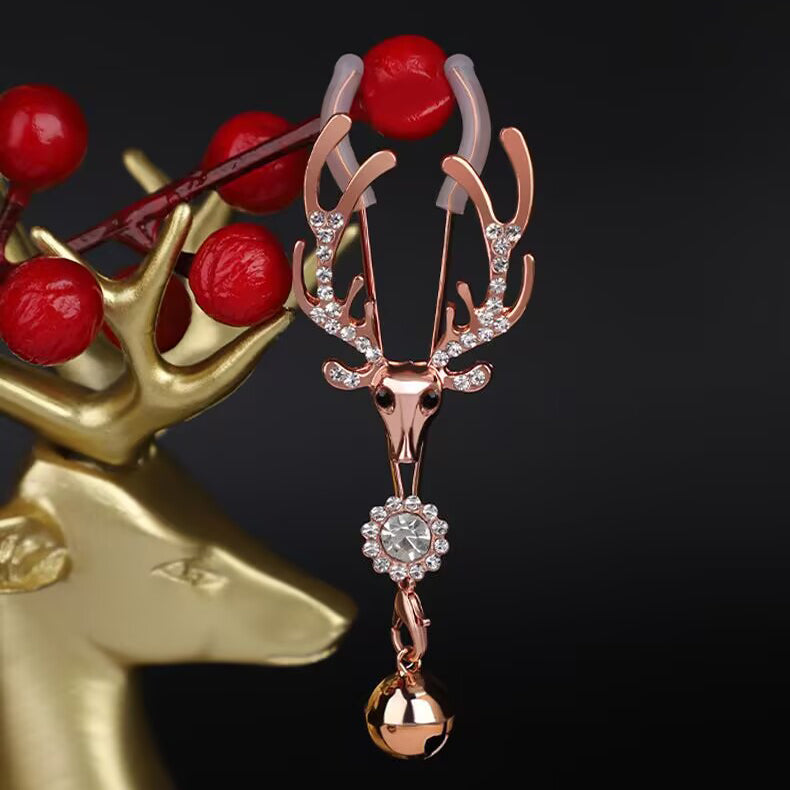 Reindeer body clamp displayed with festive red berries, ideal for holiday gift inspiration.