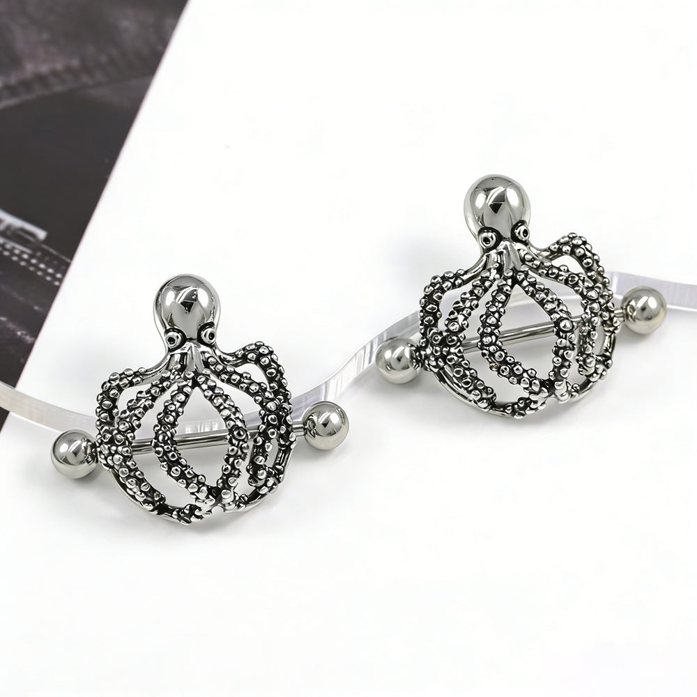 Two kraken nipple shields displayed together on a creative prop.