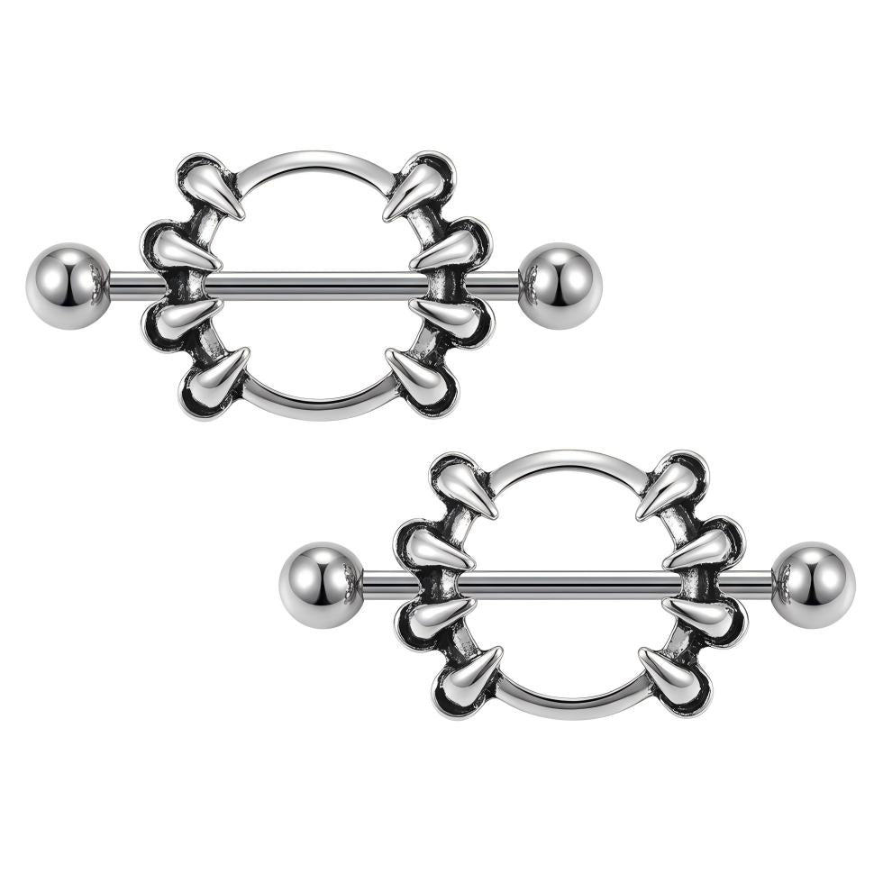 A pair of punk style nipple barbell shields displayed on a clean white background.