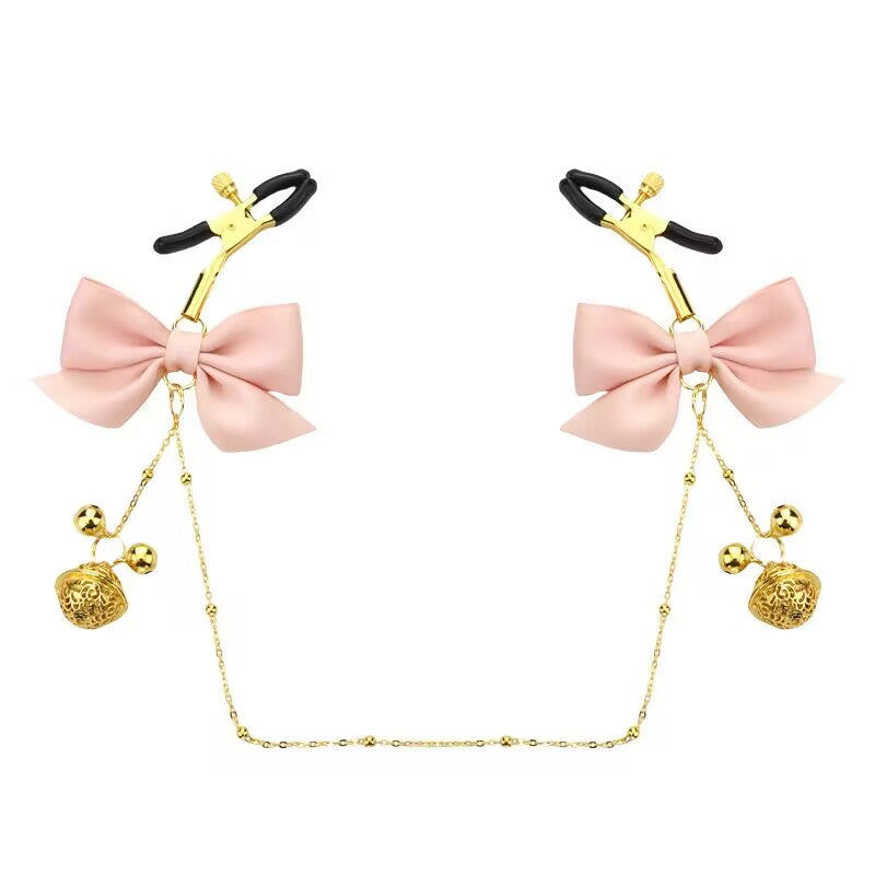 Soft pink bow sensory clamps for couples play and exploration.