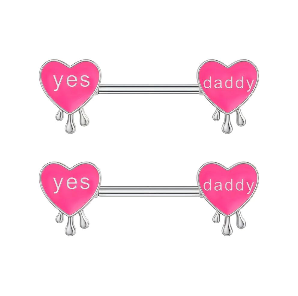 Pair of pink enamel heart nipple shields featuring "Yes Daddy" text and silver drip charms.
