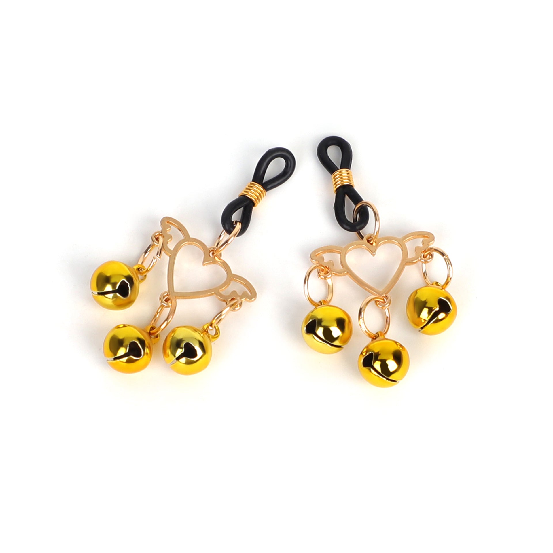 Close-up of a pair of romantic heart-shaped nipple clamps with dangling gold bells.