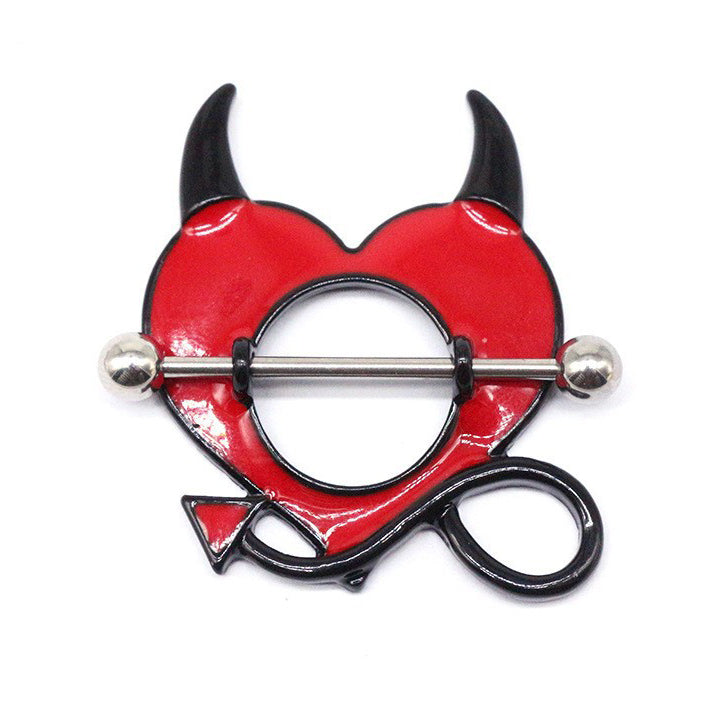 A single detailed red heart nipple shield with distinct black devil horns and arrow tail, viewed slightly from the side.