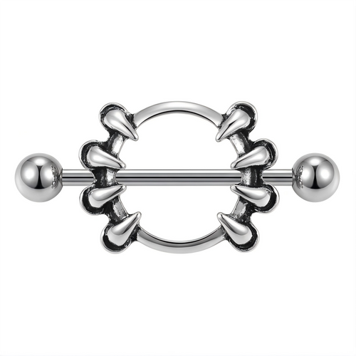 Front view of a vintage silver-tone nipple shield with eight pointed claw accents.